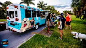 Dogs wait in line for a treat from Fido's Food Truck