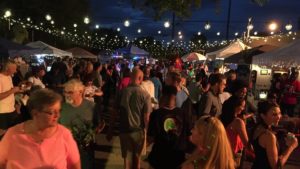 Photo of shoppers at a large night market