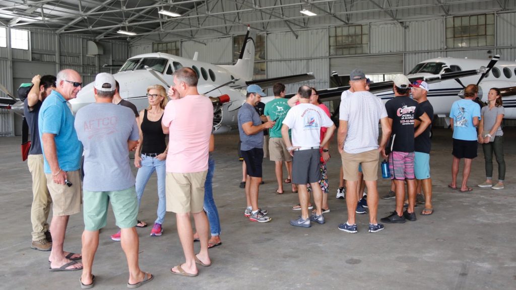 A group of volunteers gather at Albert Whitted Airport in St. Petersburg