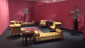 A reading room with yellow furniture