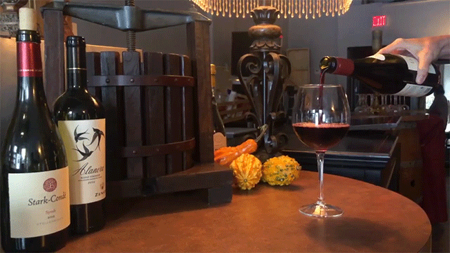 Wine being poured into a glass