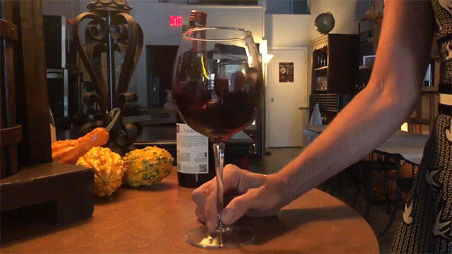 Swirling a glass of red wine