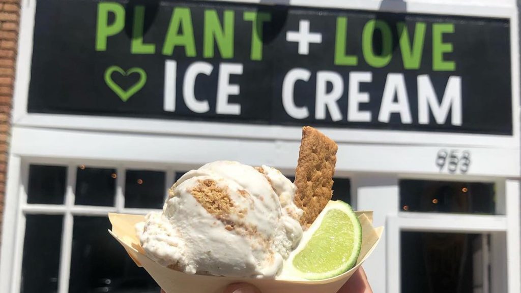 Photo of key lime pie ice cream in front of a small storefront