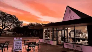 exterior of a bakery and coffee house at sunrise