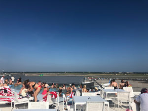 Photo of people on the rooftop pool of the TWA hotel