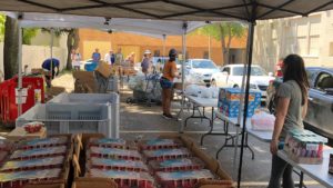 Drive through food pantry with fresh fruit, vegetables, juices, and more