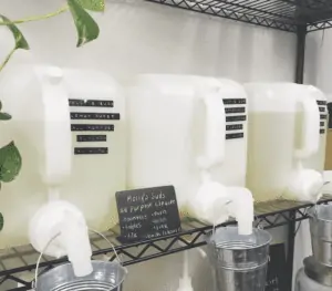 Selection of reusable containers filled with laundry detergent