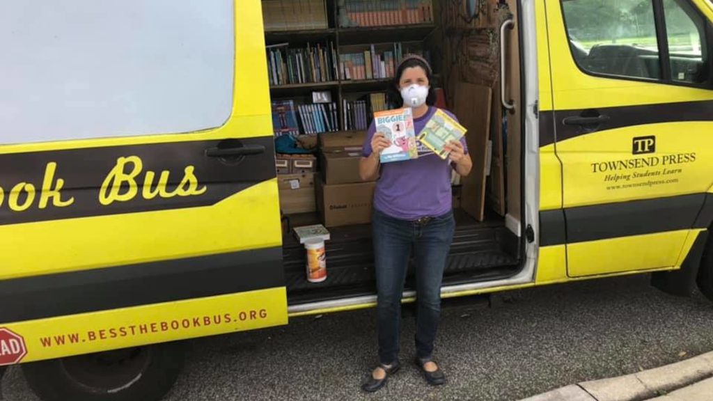 Photo of a yellow bus filled with books