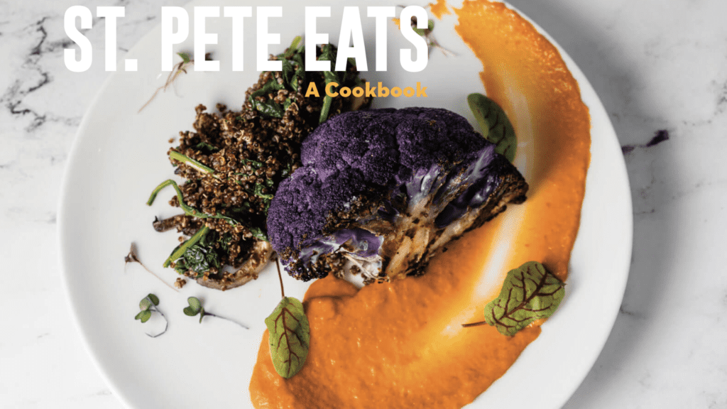 Photo of a orange and purple dish as a coverer a cookbook