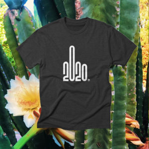 2020 Commemorative t-shirt on top of a background of cactus and flowers