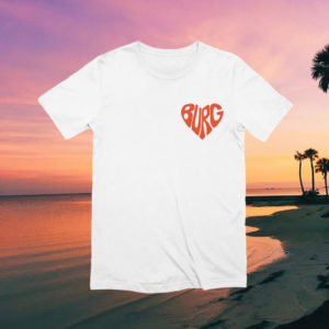 white shirt with red "burg" text in shape of heart on a photo of a sunset in the background