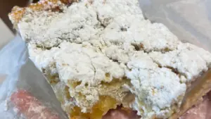 a piece of crumb cake with apple filled