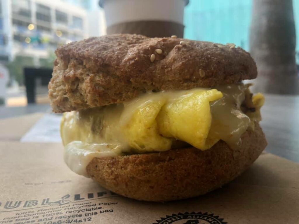 egg and cheese sandwich on a table outside