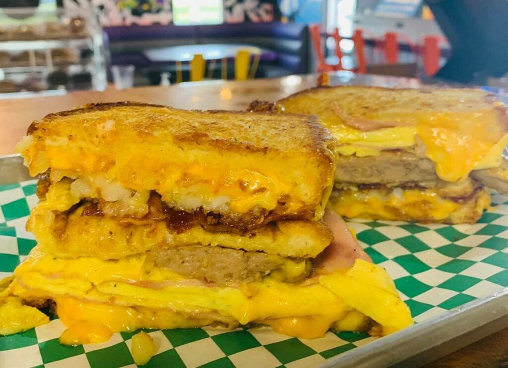 a grilled cheese sandwich with slices of meat in the middle