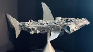 metal shark sculpture made out of found trash by local young artist