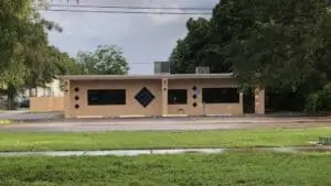 exterior of an orange brick building surrounded by grass