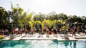 outdoor pool with a group of people practicing yoga