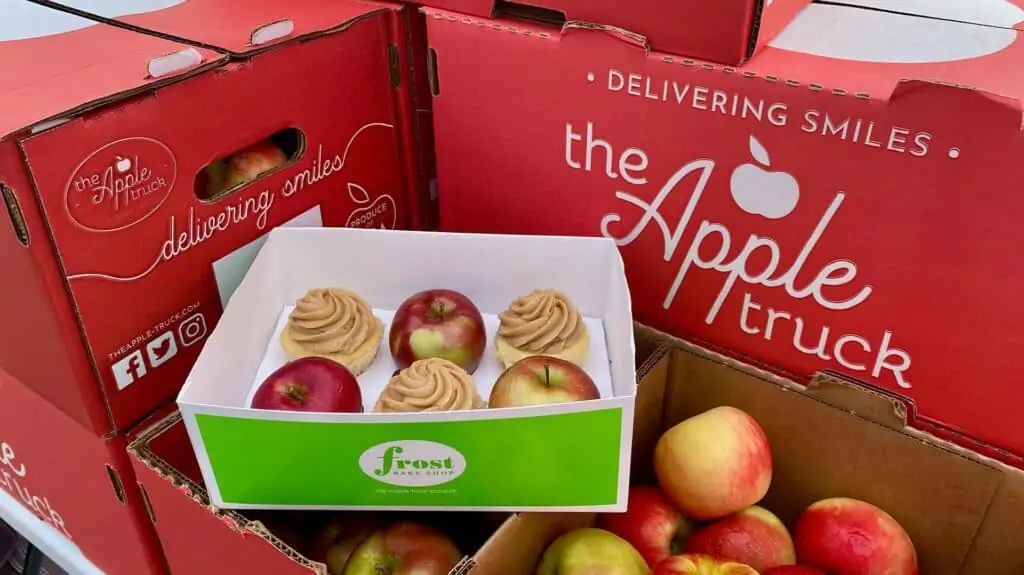 photo of apples in a basket with cupcakes