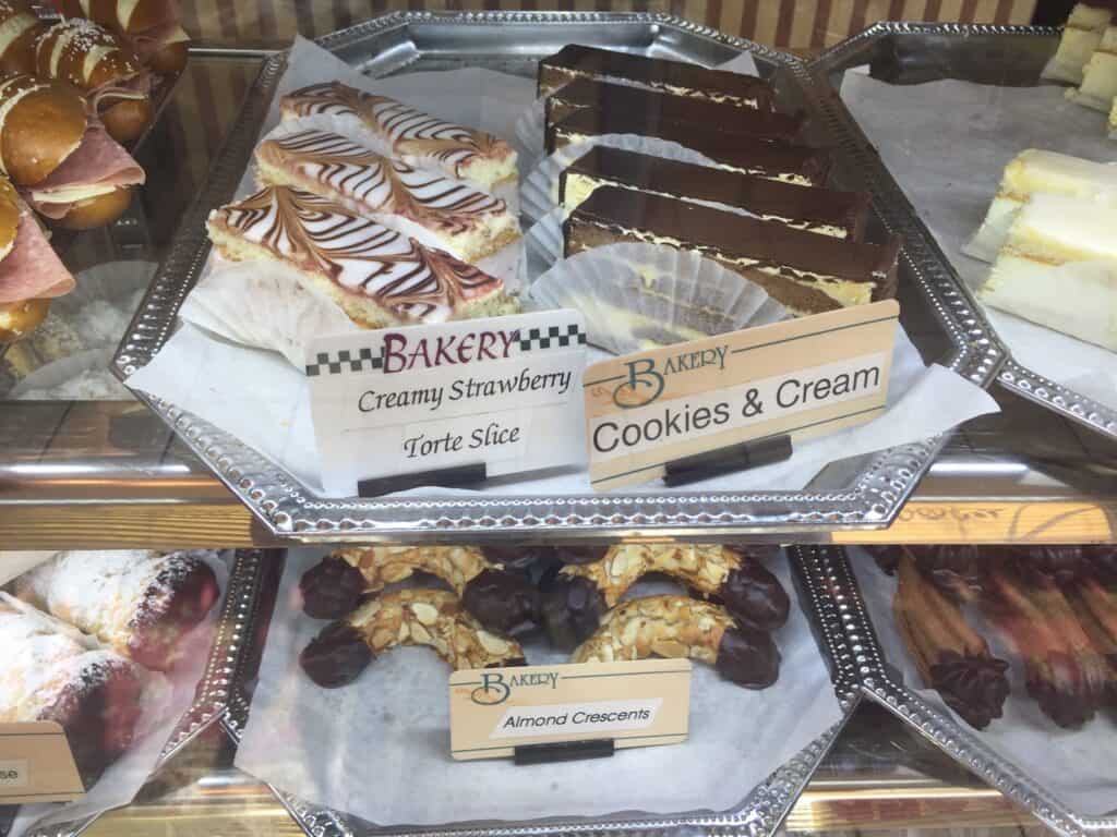 array of chocolate German pastries behind a glass case.