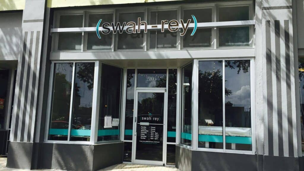 glass storefront with "swah-rey" signage above door