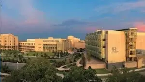 exterior of a large healthcare facility with trees around the campus