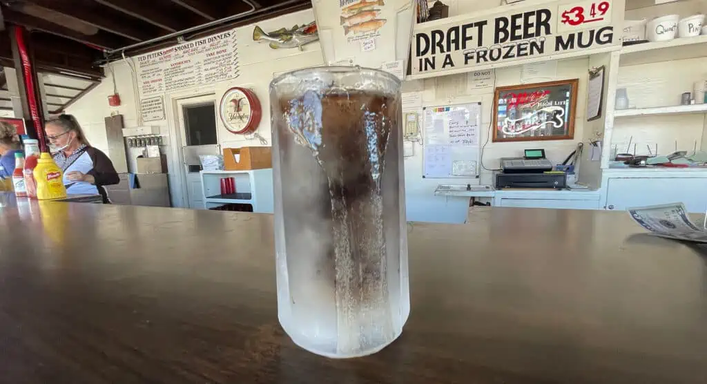 a frosted mug filled with soda