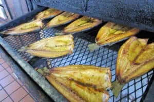 a spread of fish entering a smoker