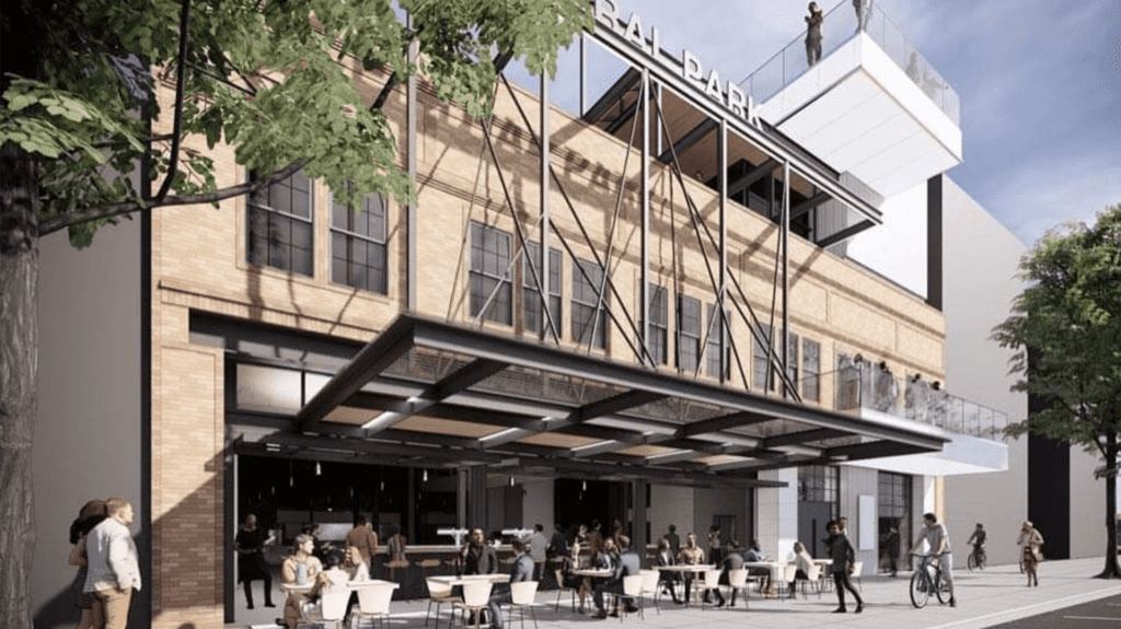 rendering of a three-story food hall with a large awning and.a brick facade