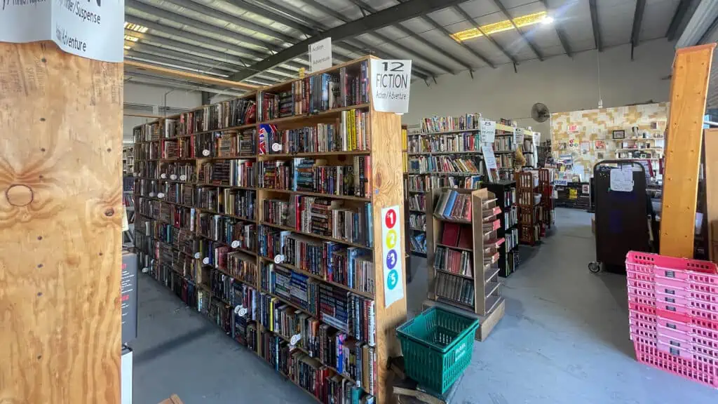 shelves upon shelves of used books in a warehouse
