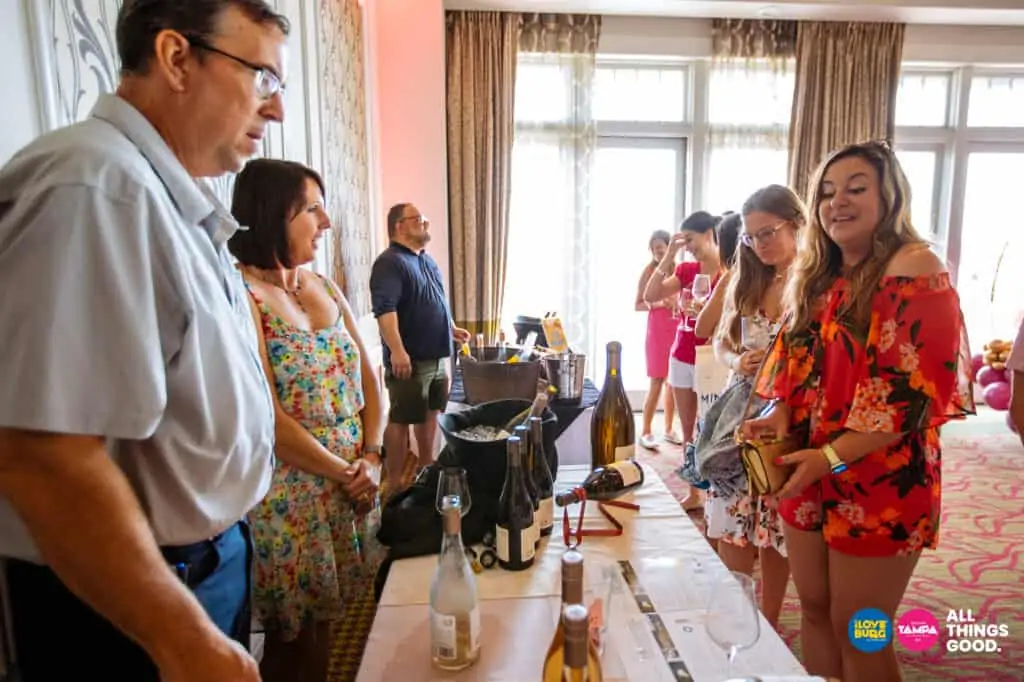 vendors serving wine to guests