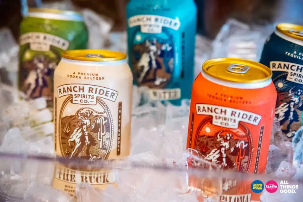 cans of ranch rider spirits sitting in an ice bucket