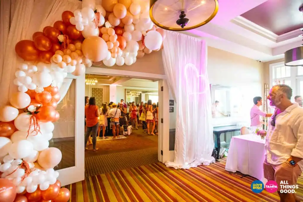 a balloon arch extends over the doorway