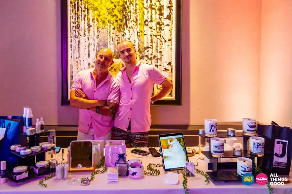Owners Jim + Julien of JULIEN with their candles and skincare products