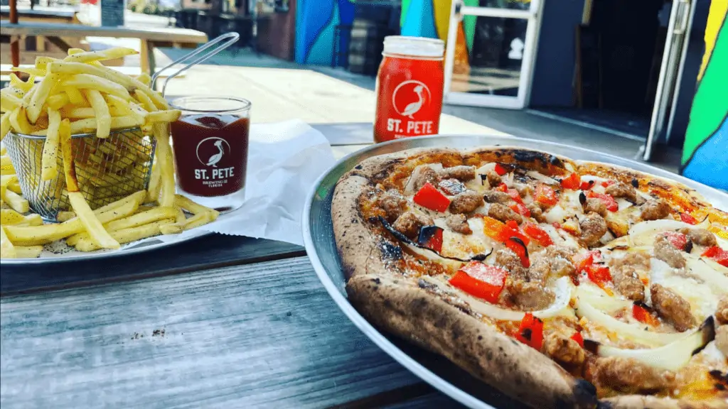 A pizza, beer and shoestring fries at St. Pete Brewing Company