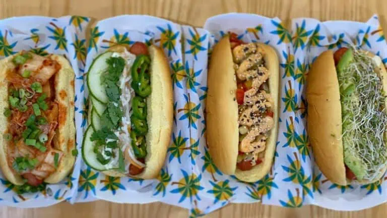aerial view of several hot dogs lined up on a counter top