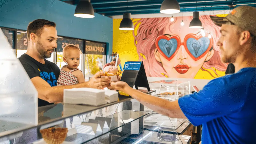 A father and his daughter getting ice cream