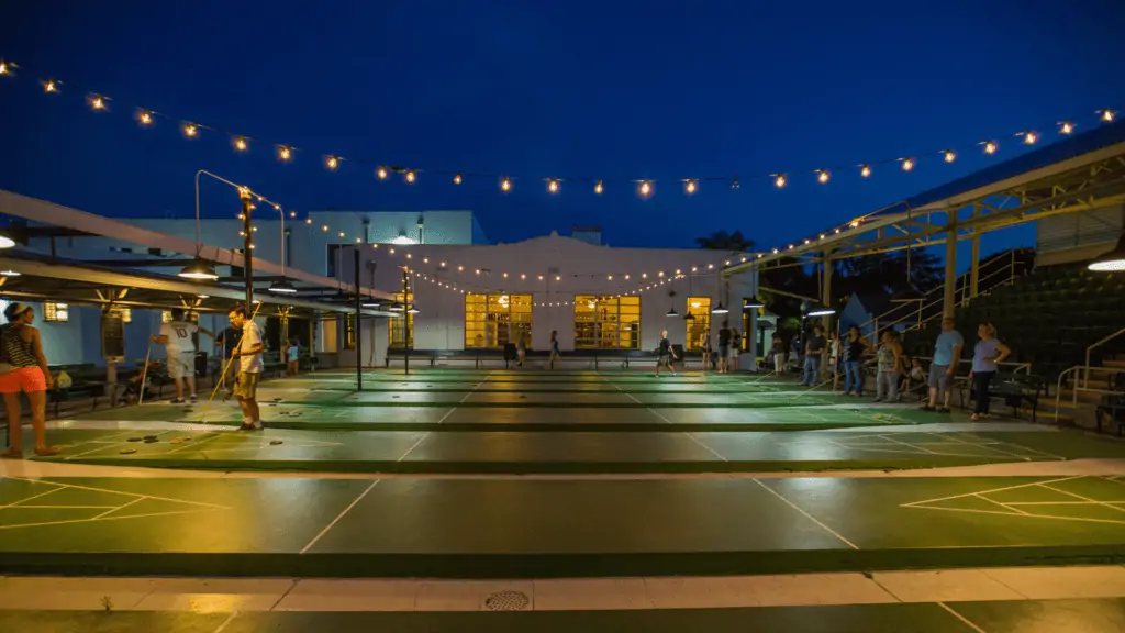 The shuffleboard courts lit up at night