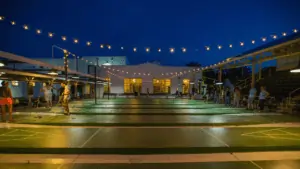 The shuffleboard courts lit up at night