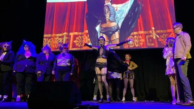 Several people on a stage dressed in attire based on the film Rocky Horror Picture Show