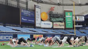 people doing yoga at the trop