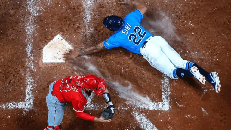A rays player safely sliding into homeplate