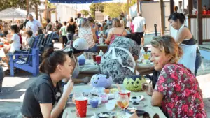 People painting pumpkins at 3 Daughters