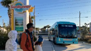 The Kile family waiting on the SunRunner bus