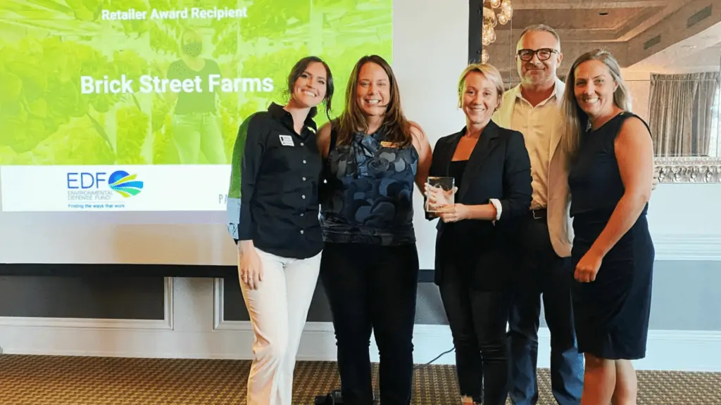 Brick Street Farms employees receiving an award