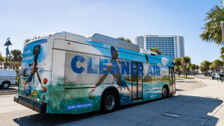 A PSTA bus by the sidewalk