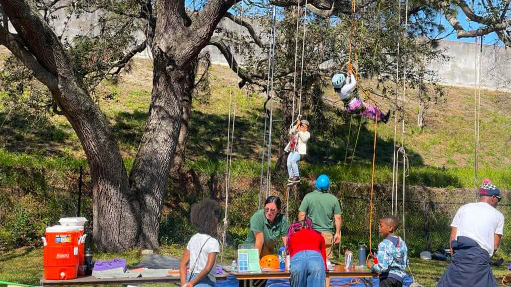 Kids learn climbing at Tampa Bay Collard Greens Festival