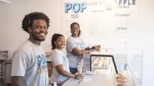 Employees inside Pop Goes the Waffle