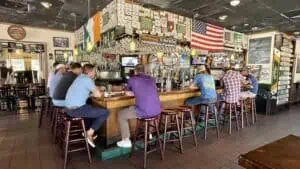 People sitting at the bar inside Courigan's