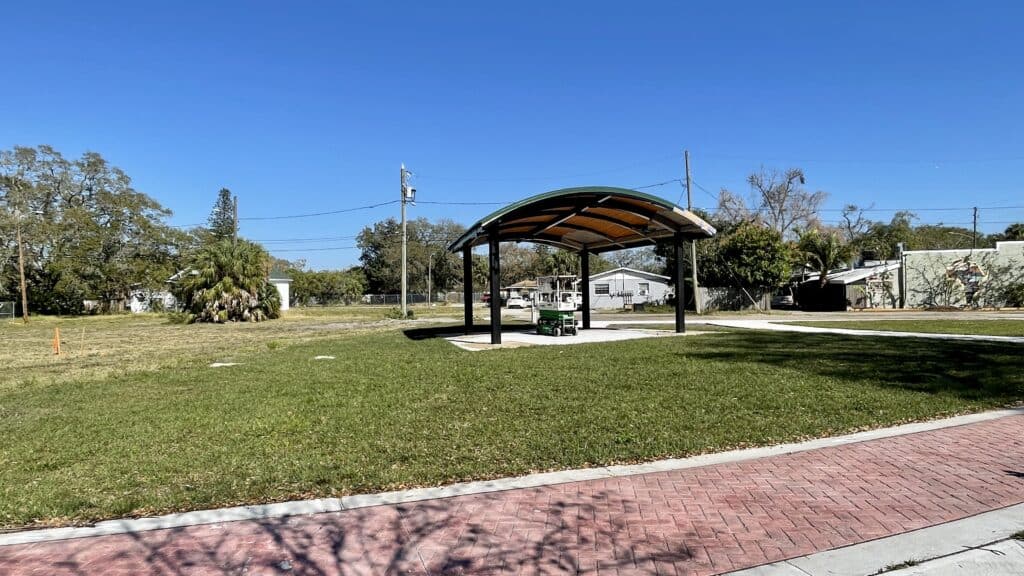 A wide shot of a green space in the Deuces Live District