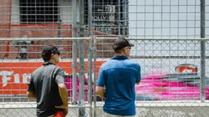 Two men watching the grand prix